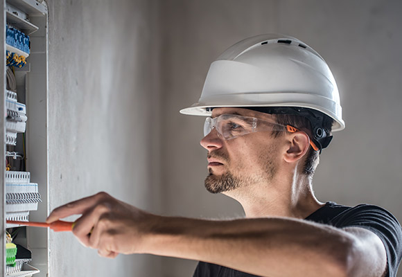 Man Installing a Commercial Fire Alarm System in Deerfield Beach